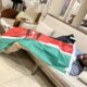 CNN Reporter Larry Madowo Wakes Up Covered in Kenyan Flag During Haiti Visit